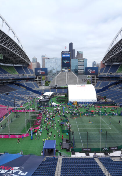 Overhead view inside Lumen Field showing MLB Play Ball Park 2023 setup with mini baseball diamonds, Home Run Derby zone, and crowds across field
