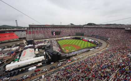 Aerial stadium view of MLB Speedway Classic 2025 at Bristol Motor Speedway with baseball field inside track and packed grandstands surrounding
